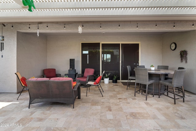 view of patio featuring an outdoor living space and a pergola