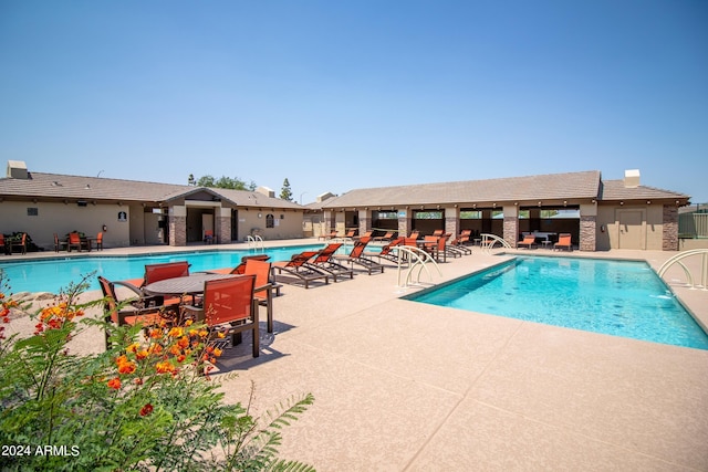 view of pool featuring a patio