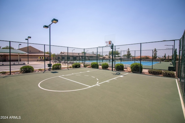 view of sport court with tennis court