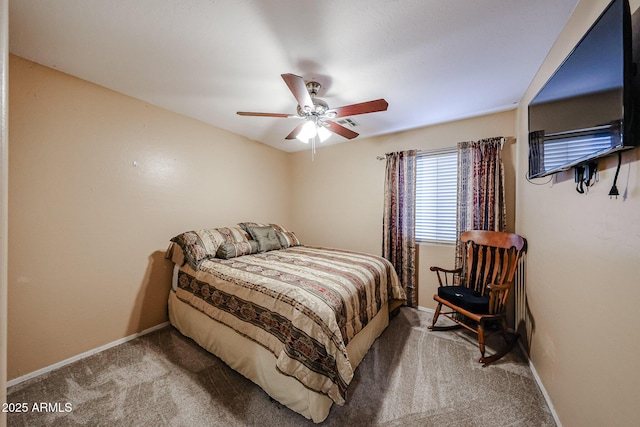 carpeted bedroom with ceiling fan and baseboards