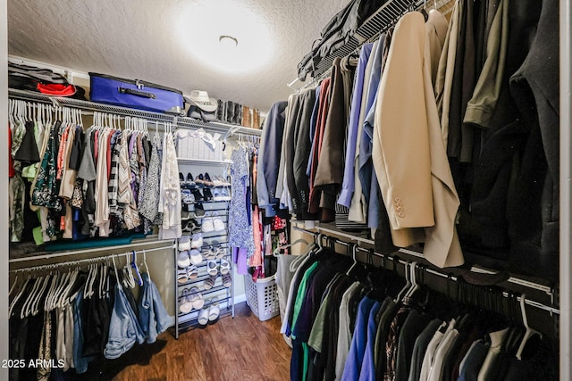 spacious closet with wood finished floors