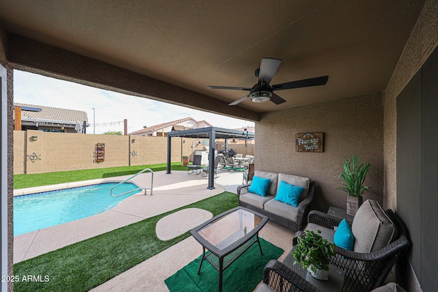 view of pool with a ceiling fan, a patio, a fenced backyard, a fenced in pool, and an outdoor hangout area