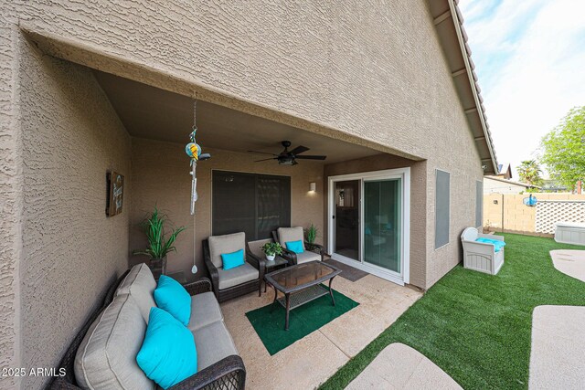 view of patio with a ceiling fan, fence, and an outdoor hangout area