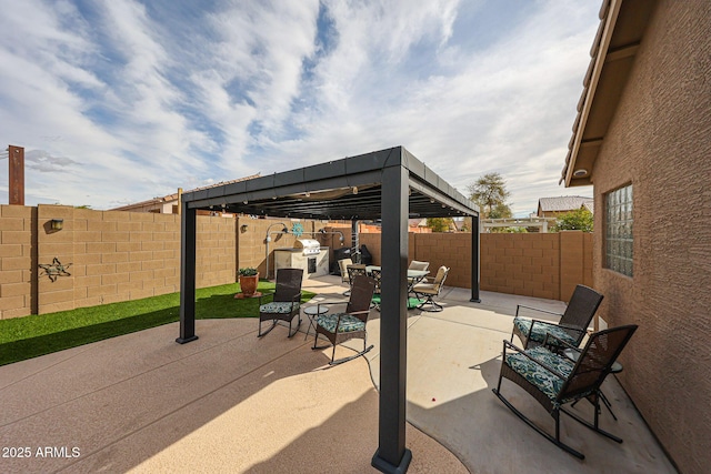 view of patio with outdoor dining area and a fenced backyard