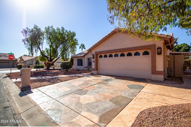 ranch-style home featuring a garage