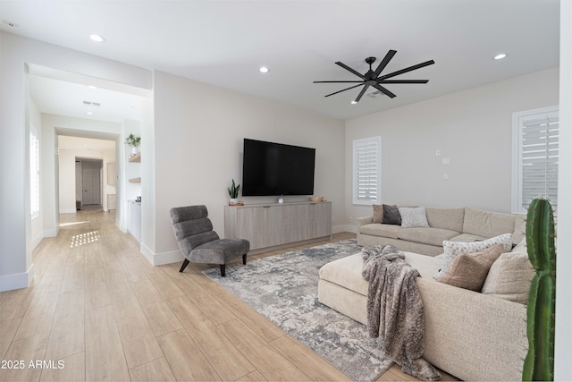 3356 E Vallejo Ct, Gilbert, AZ 85298 - living room with recessed lighting, light wood-type flooring, a ceiling fan, visible vents, and baseboards