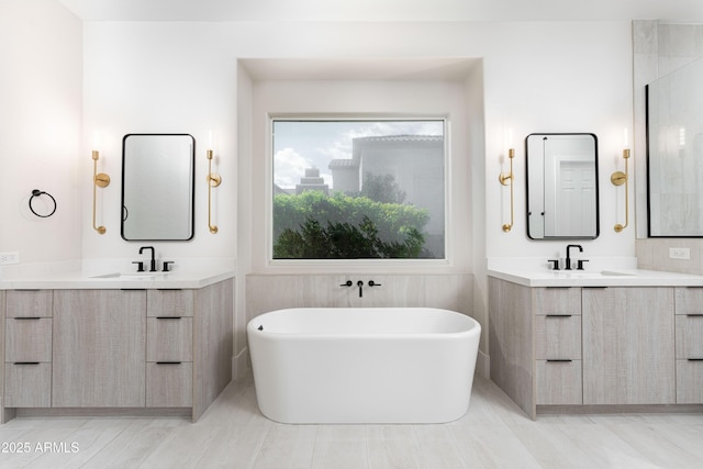 3356 E Vallejo Ct, Gilbert, AZ 85298 - bathroom with two vanities, a freestanding bath, and a sink