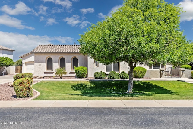 3356 E Vallejo Ct, Gilbert, AZ 85298 - view of front facade with a tile roof, stucco siding, an attached garage, and fence