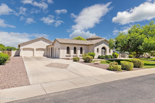 3356 E Vallejo Ct, Gilbert, AZ 85298 - mediterranean / spanish-style home featuring driveway, a tile roof, stucco siding, and a garage