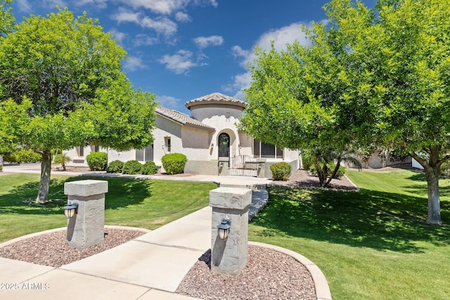 3356 E Vallejo Ct, Gilbert, AZ 85298 - mediterranean / spanish home with a front lawn, stucco siding, and a tiled roof