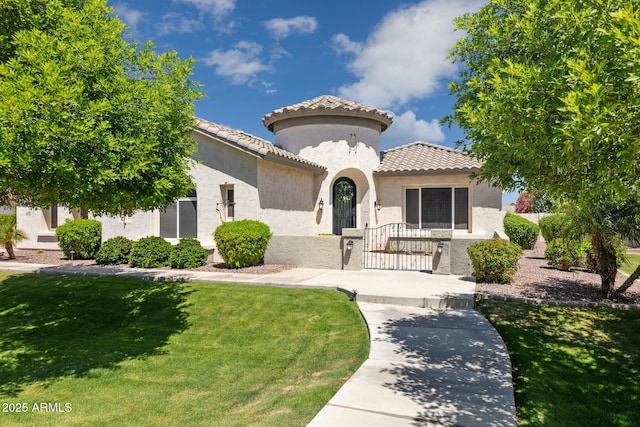 3356 E Vallejo Ct, Gilbert, AZ 85298 - mediterranean / spanish-style house featuring stucco siding, a tiled roof, and a front yard