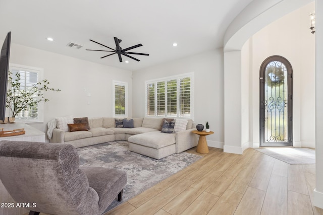 3356 E Vallejo Ct, Gilbert, AZ 85298 - living area featuring wood finished floors, visible vents, ceiling fan, and a healthy amount of sunlight