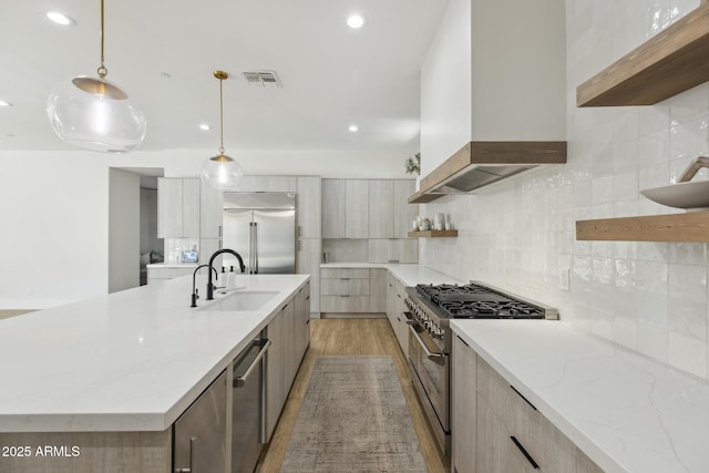 3356 E Vallejo Ct, Gilbert, AZ 85298 - kitchen featuring a sink, modern cabinets, premium appliances, open shelves, and wall chimney exhaust hood