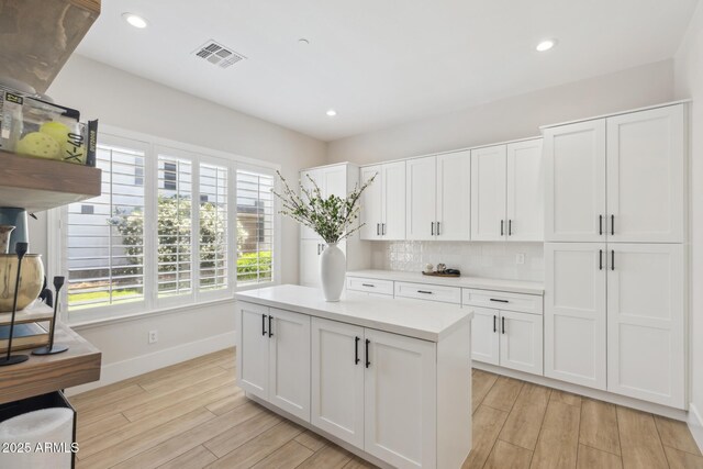 3356 E Vallejo Ct, Gilbert, AZ 85298 - kitchen featuring baseboards, visible vents, and white cabinetry