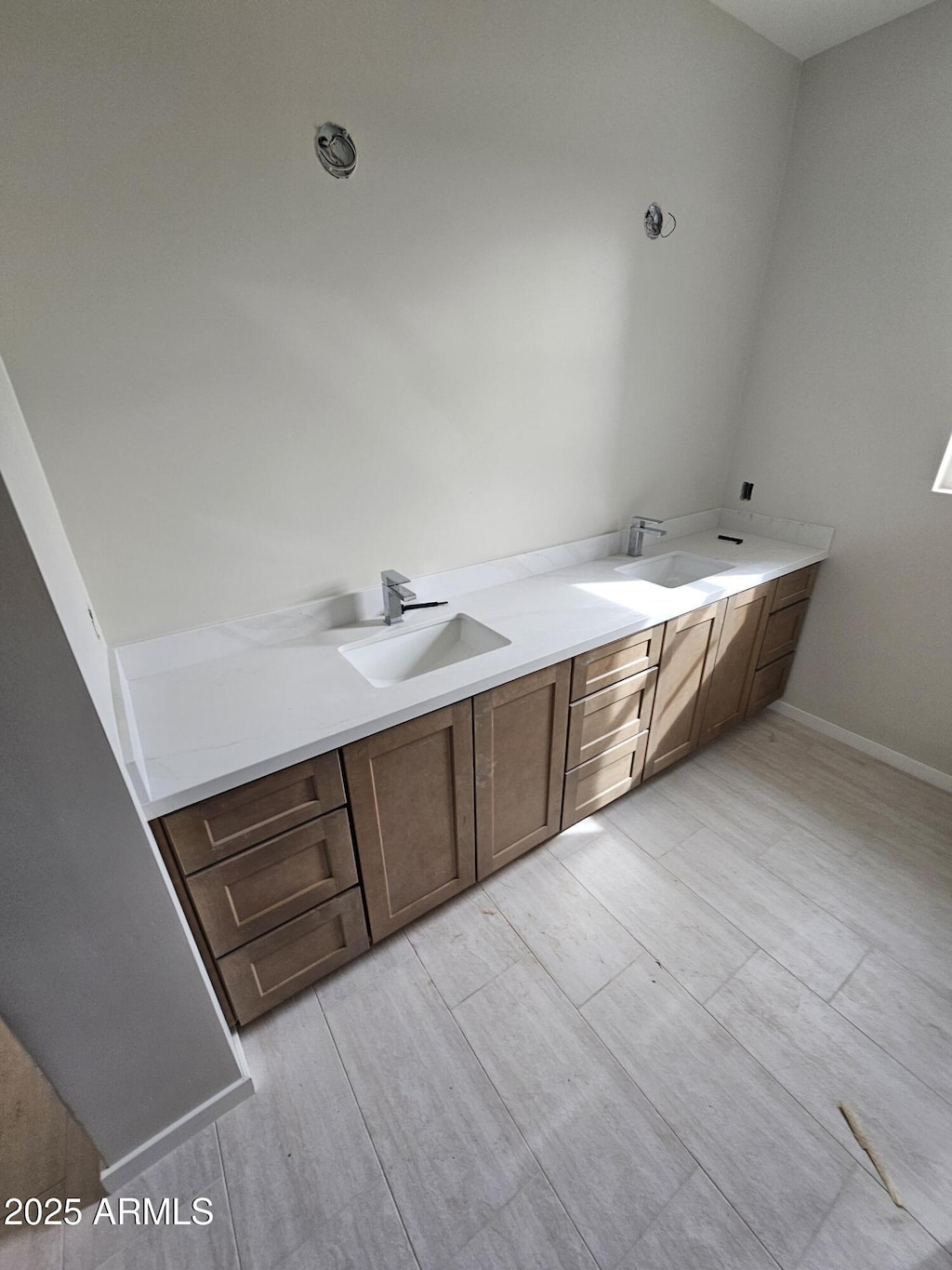bathroom with double vanity and a sink