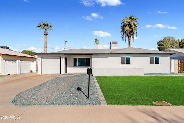 ranch-style home featuring central AC unit, a garage, and a front lawn