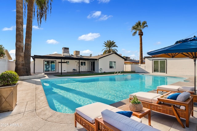 view of swimming pool featuring central AC unit and a patio