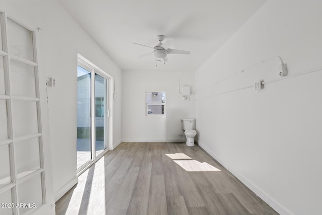 bathroom with wood-type flooring and ceiling fan