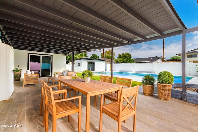 view of patio / terrace with a fenced in pool and an outdoor structure