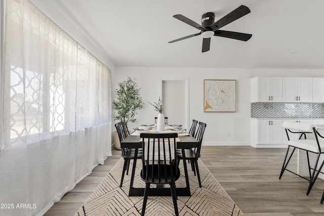 dining area featuring ceiling fan and light hardwood / wood-style floors