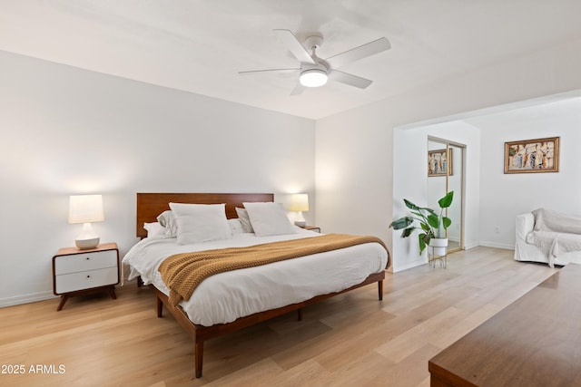 bedroom with light wood-type flooring and ceiling fan