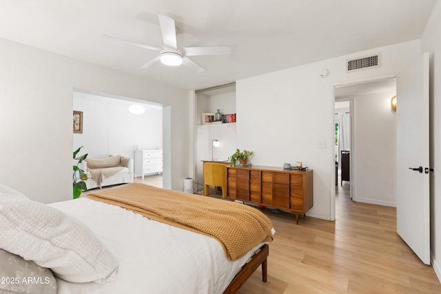 bedroom featuring ceiling fan and light hardwood / wood-style flooring