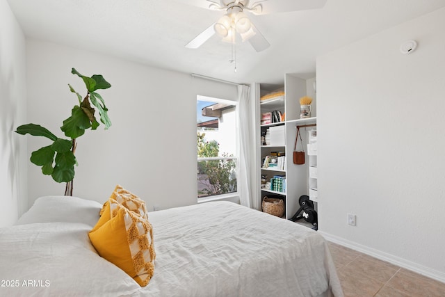 tiled bedroom with ceiling fan