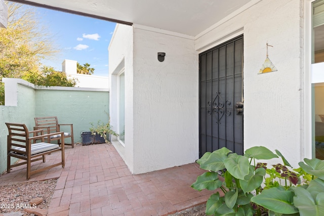 property entrance with a patio