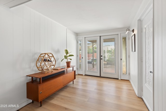 doorway to outside with french doors and light hardwood / wood-style floors