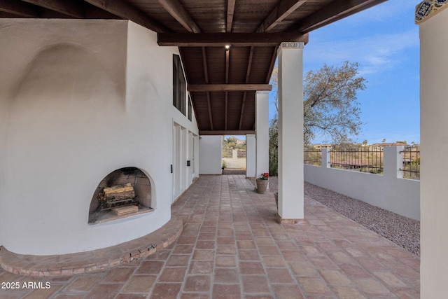 view of patio featuring an outdoor fireplace