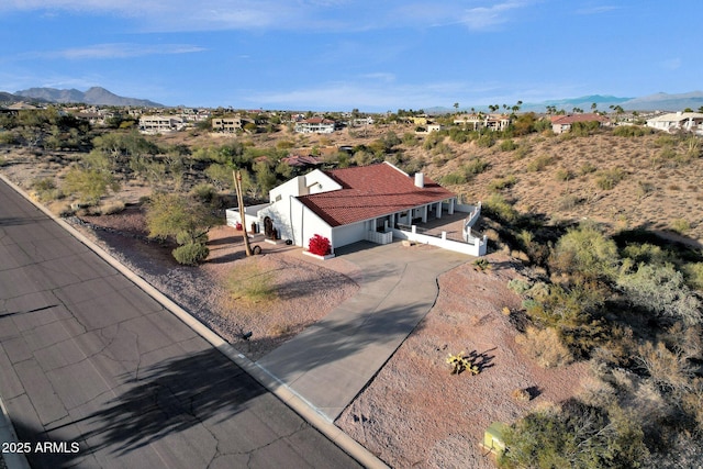 drone / aerial view featuring a mountain view