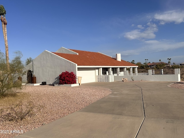 view of front of home with a porch and a garage