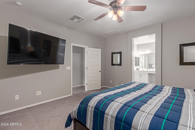 carpeted bedroom featuring connected bathroom and ceiling fan