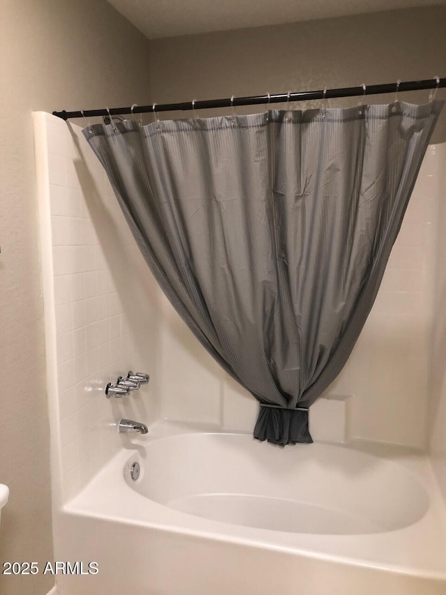 full bathroom with shower / tub combo with curtain