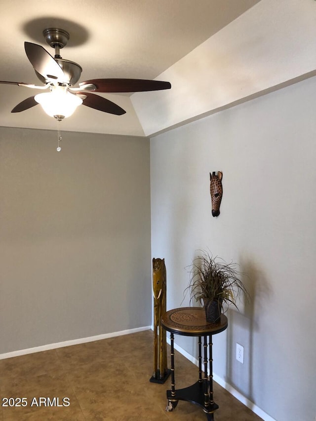 dining space featuring a ceiling fan and baseboards