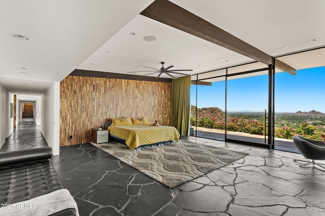 4925 E Red Rock Dr Unit 43, Phoenix, AZ 85018 - bedroom with wood walls, expansive windows, access to exterior, and recessed lighting