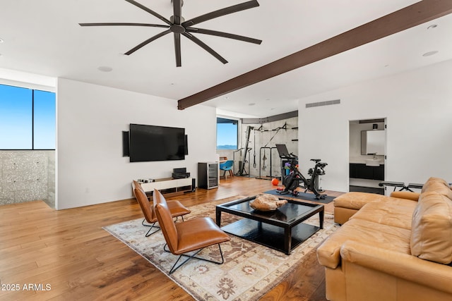 4925 E Red Rock Dr Unit 43, Phoenix, AZ 85018 - living room featuring a ceiling fan, beam ceiling, and wood finished floors