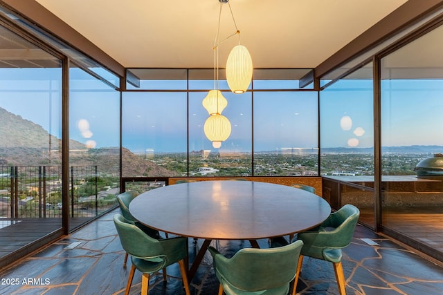 4925 E Red Rock Dr Unit 43, Phoenix, AZ 85018 - sunroom featuring floor to ceiling windows, plenty of natural light, a mountain view, and stone finish floors