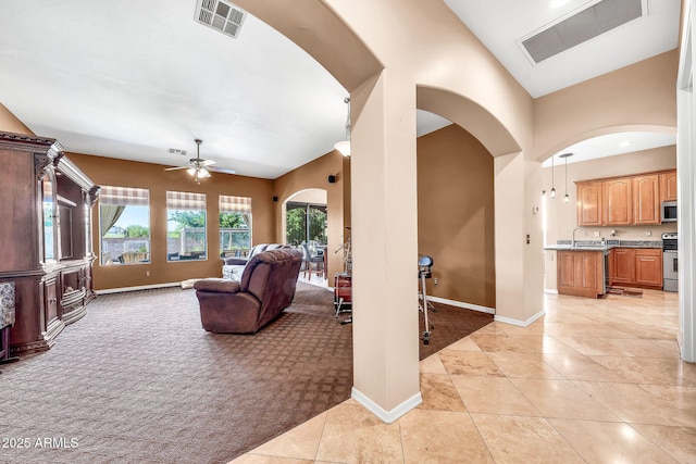 747 E Meadow Ln, Phoenix, AZ 85022 - living area featuring arched walkways, baseboards, ceiling fan, and visible vents
