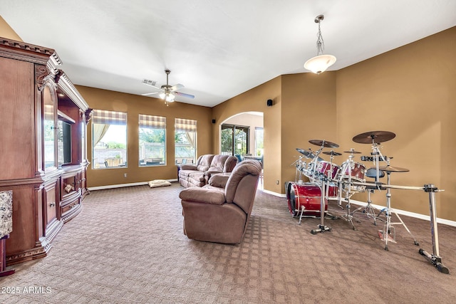 747 E Meadow Ln, Phoenix, AZ 85022 - carpeted living area with baseboards, arched walkways, ceiling fan, and visible vents