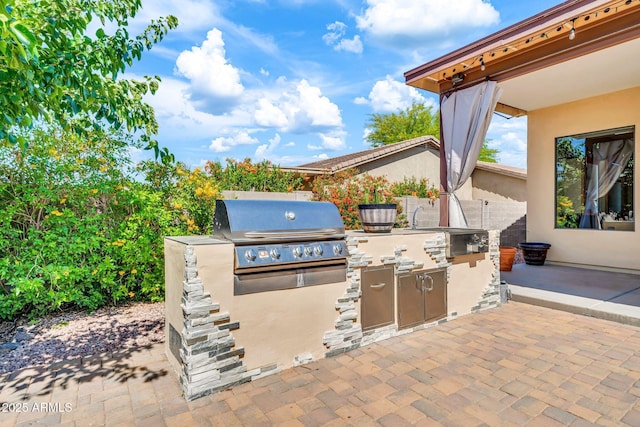747 E Meadow Ln, Phoenix, AZ 85022 - view of patio / terrace with exterior kitchen and a grill