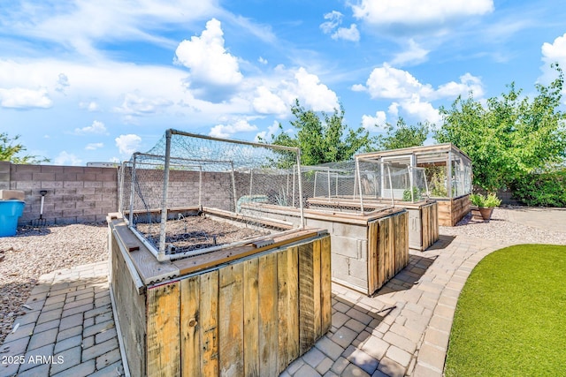 747 E Meadow Ln, Phoenix, AZ 85022 - view of patio featuring fence and a vegetable garden
