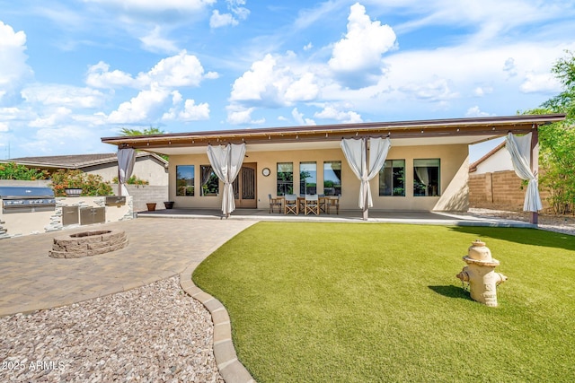 747 E Meadow Ln, Phoenix, AZ 85022 - rear view of property with a patio, an outdoor fire pit, stucco siding, and area for grilling