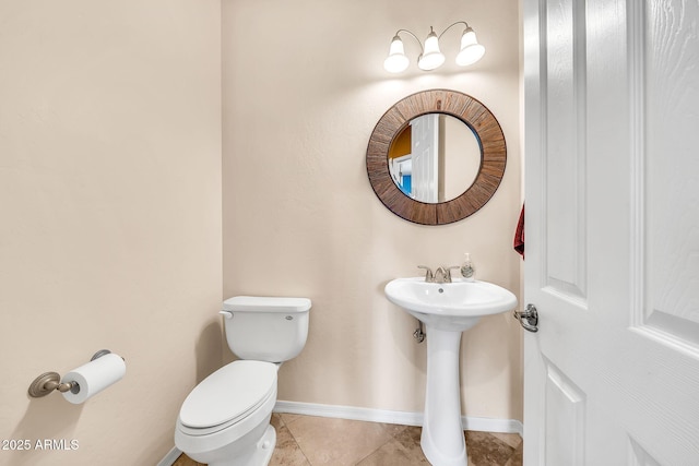 747 E Meadow Ln, Phoenix, AZ 85022 - half bathroom with toilet, baseboards, a sink, and tile patterned floors