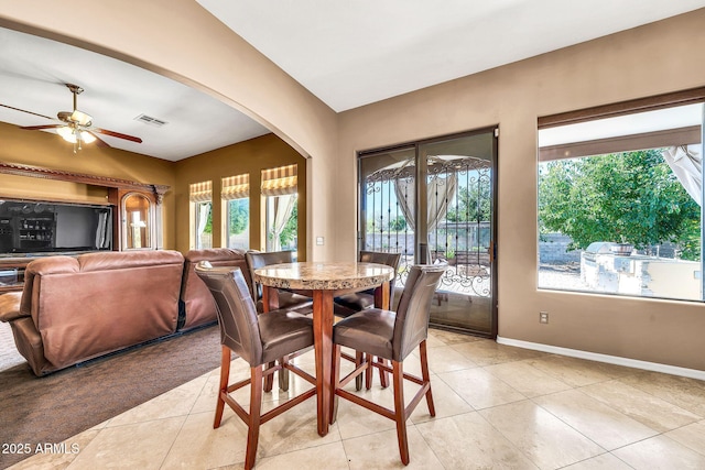 747 E Meadow Ln, Phoenix, AZ 85022 - dining area featuring a healthy amount of sunlight, arched walkways, light tile patterned floors, and visible vents