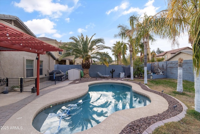 view of swimming pool featuring a patio area, a fenced backyard, a fenced in pool, and a pergola