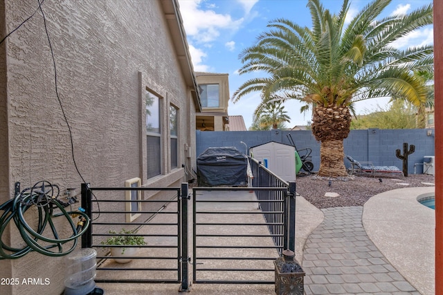 view of patio with a fenced backyard and a gate