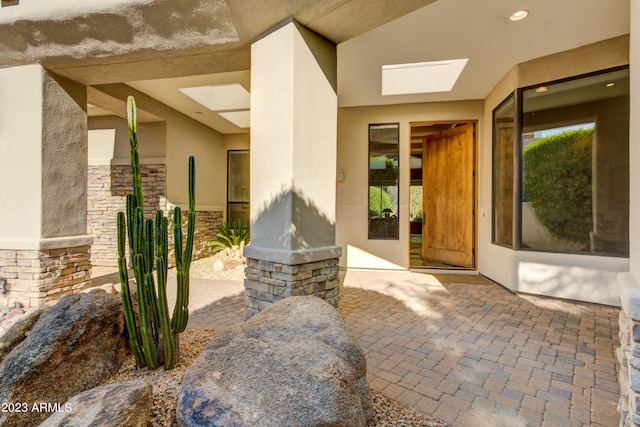 entrance to property with a patio area