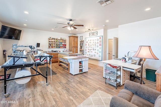 home office with recessed lighting, visible vents, and light wood finished floors