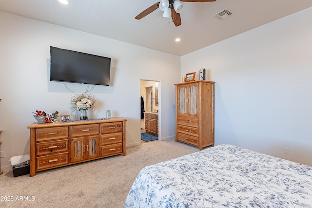 bedroom with connected bathroom, recessed lighting, light colored carpet, visible vents, and baseboards